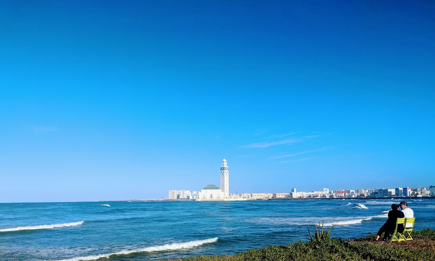 white lighthouse near body of water during daytime