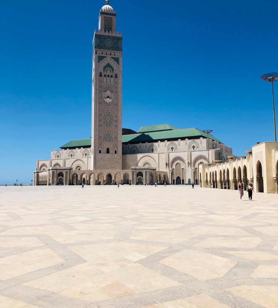 green and white concrete building under blue sky during daytime